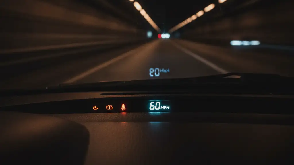 Speedometer needle hovering above the speed limit, blurred motion background.