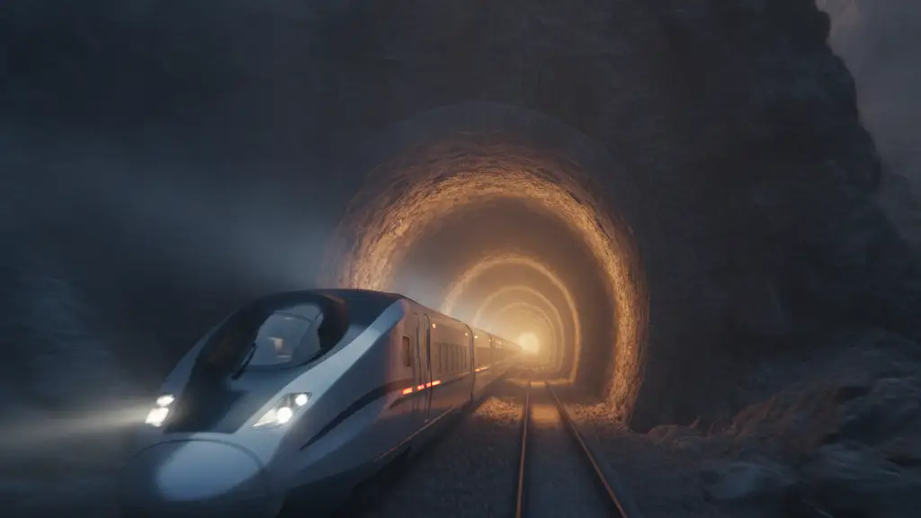 High-speed train emerging from a dark tunnel, motion blur.