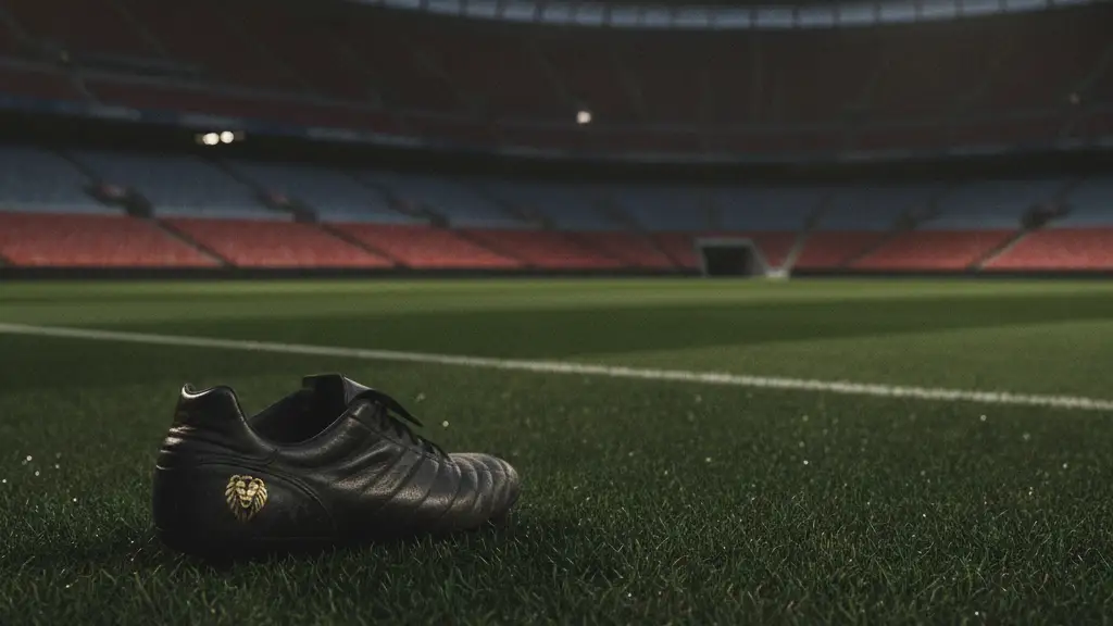 A single football boot on a stadium pitch under dramatic lights.