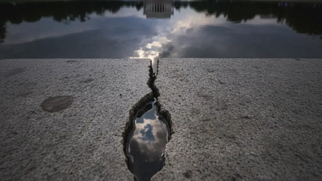 A large crack in the concrete edge of the Lincoln Memorial Reflecting Pool.