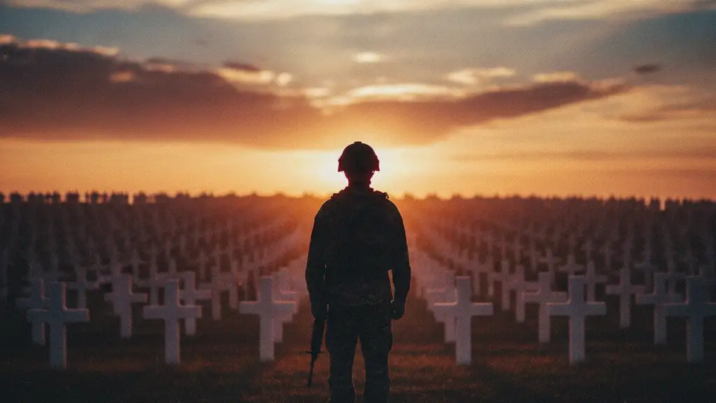 Silhouetted soldier stands before a field of white crosses at sunset.