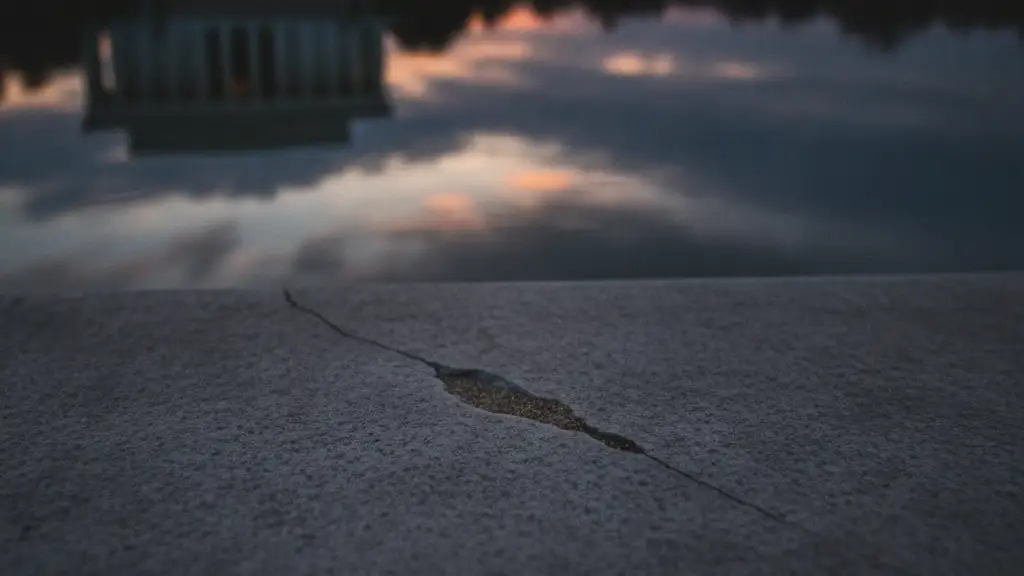 Subtle damage on the edge of the Lincoln Memorial Reflecting Pool at twilight.