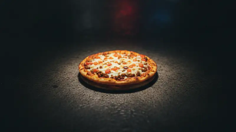 Taco Bell's $1 Mexican Pizza Promotion Amid Cyclosporiasis Outbreak