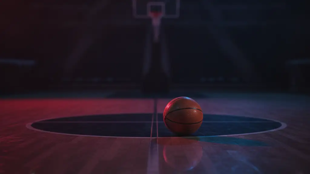 Basketball on court reflecting emergency lights, suggesting tension.