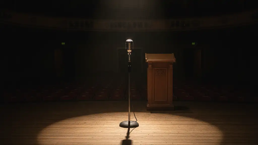 A lone microphone on an empty stage under a spotlight, casting a long shadow.