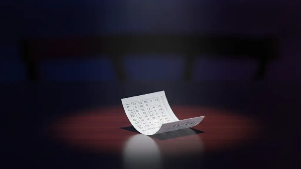A single lottery ticket illuminated by a dramatic spotlight on a dark, polished table.