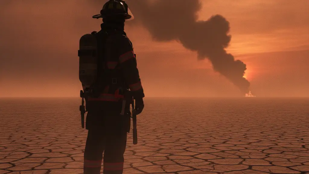 Silhouette of a firefighter on dry land, smoke rising in the distance.