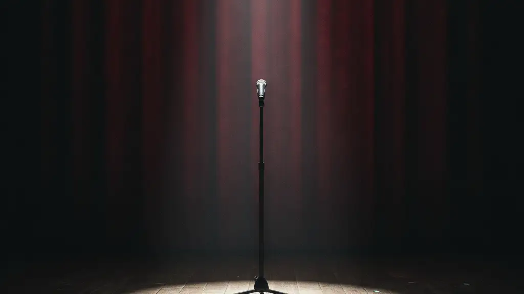 Empty microphone stand on a dark stage with a single spotlight.