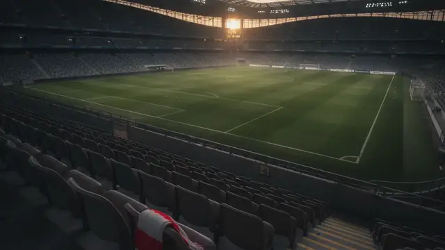 A red and white football scarf draped over an empty stadium seat.