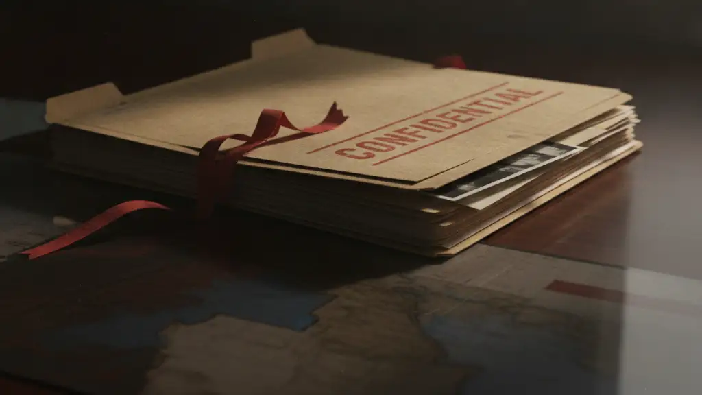 Confidential file folder on a dark desk, hinting at sensitive documents.