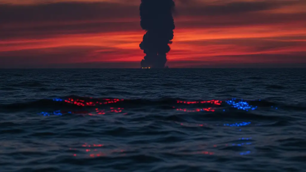 Thick smoke plume rising from the distant ocean at dusk, emergency lights reflecting on water.